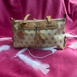 Dooney and Burke leather shoulder bag with tassel accent multi colored zipper.